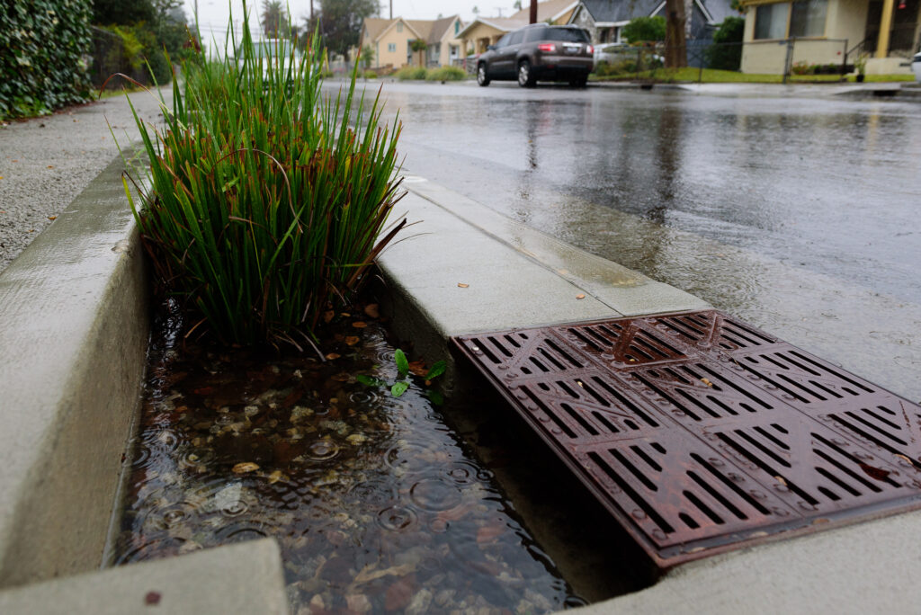 photo of a storm drain during rain